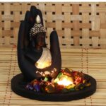 Polyresin Black and Golden Handcrafted Palm Buddha Statue with Wooden Base Tealight Candle Holder